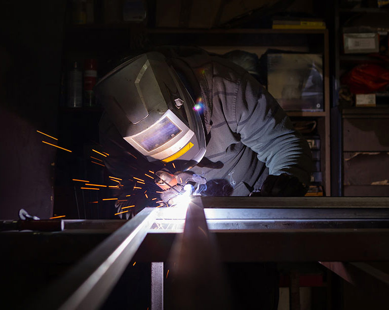 Brazos Manufacturing Welding Background Mobile - Brazos Manufacturing